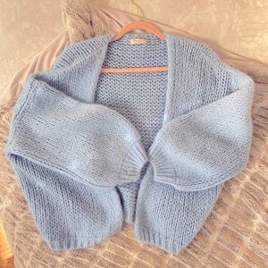 Soft blue knit cardigan with balloon sleeves